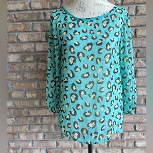 Coveted Clothing Green Animal Print Sheer 3/4 Sleeve Relaxed Blouse.